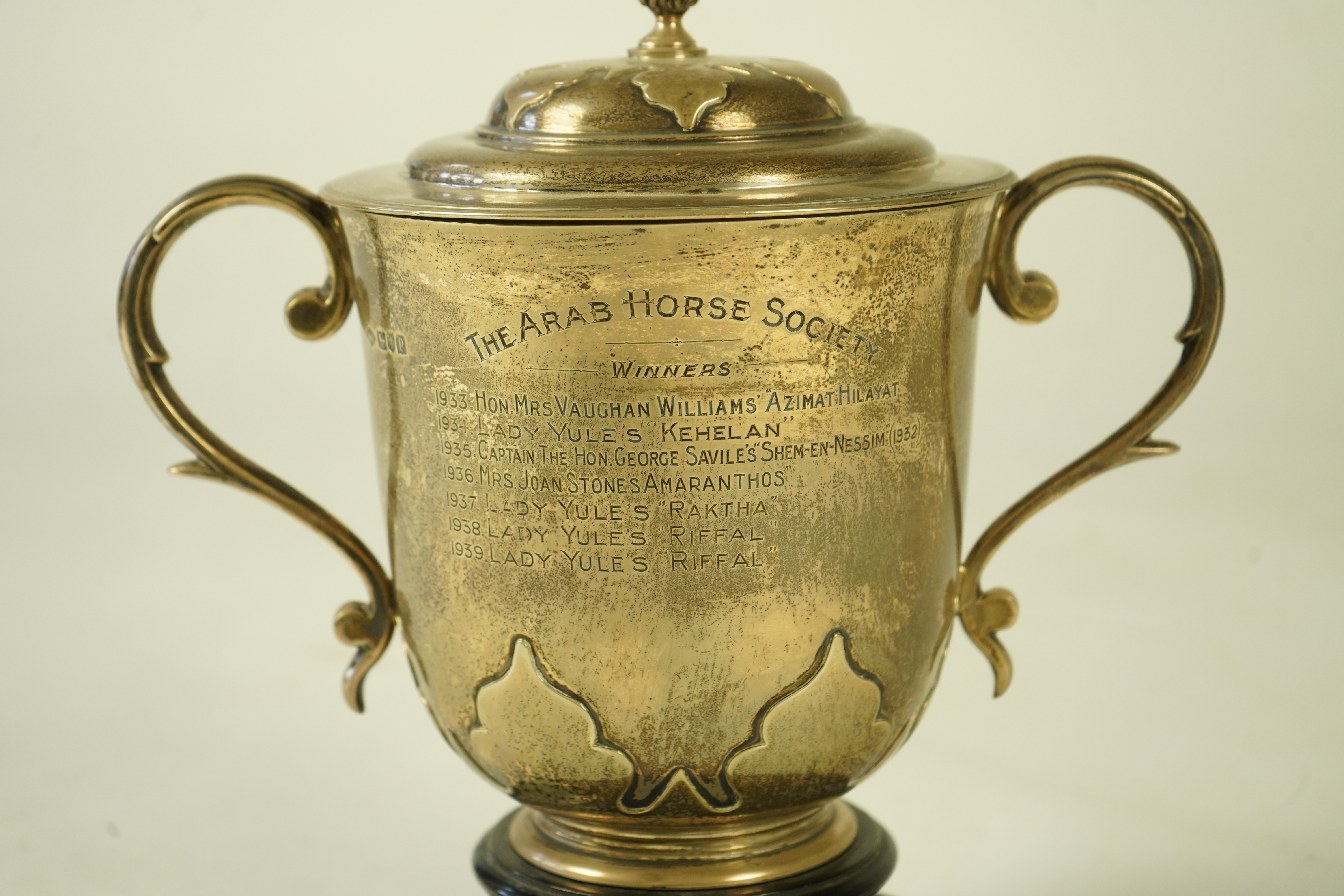 A George V silver two handled presentation cup and cover by Johnson, Walker & Tolhurst, with later engraved horse racing inscription relating to 'The Arab Horse Society Challenge Cup for the Best Arab Colt'